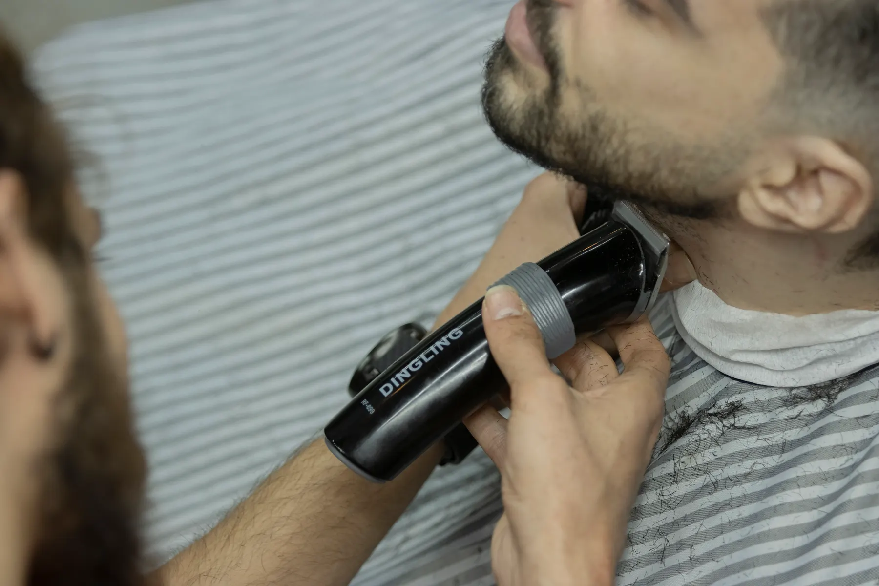 Beard neckline being cleaned up with a trimmer